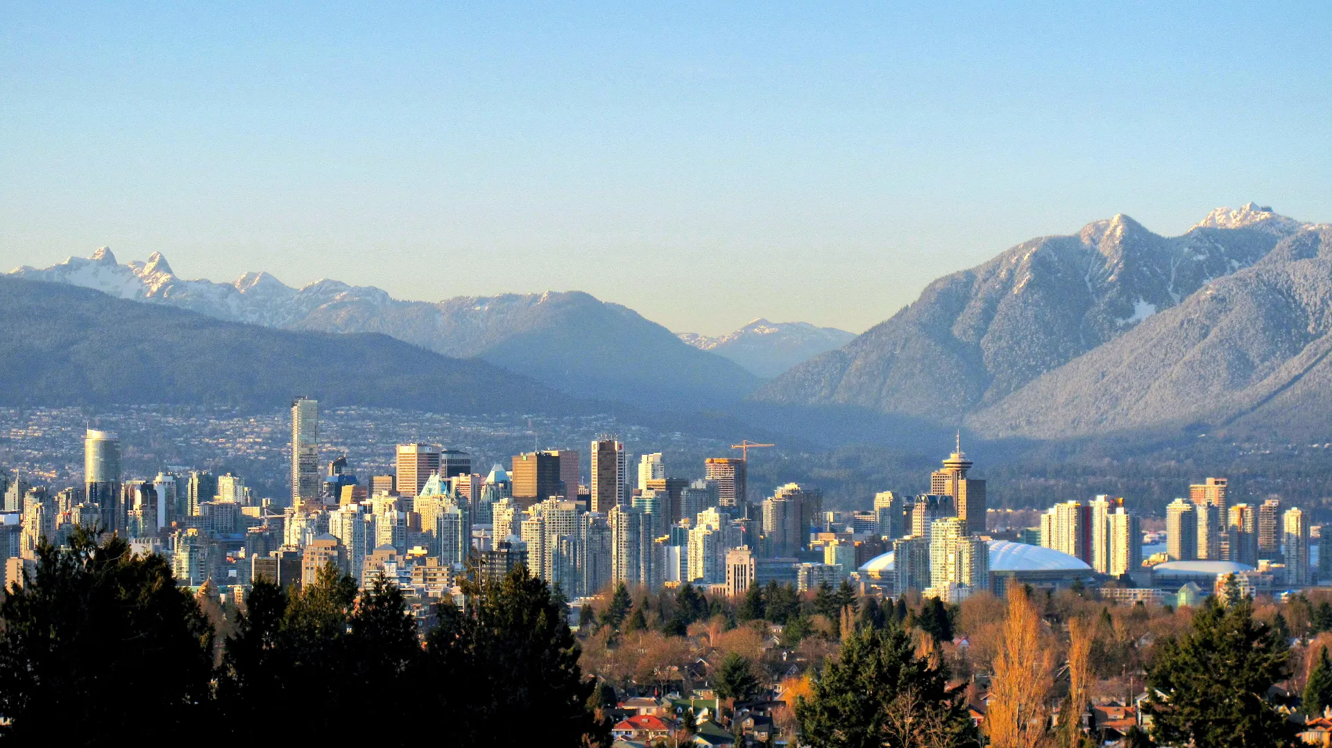 [Vancouver skyline](https://commons.wikimedia.org/wiki/File:Vancouver_Skyline_and_Mountains.webp) image by Kyle Pearce/ DIY Genius, CC BY-SA 2.0, via Wikimedia Commons.
